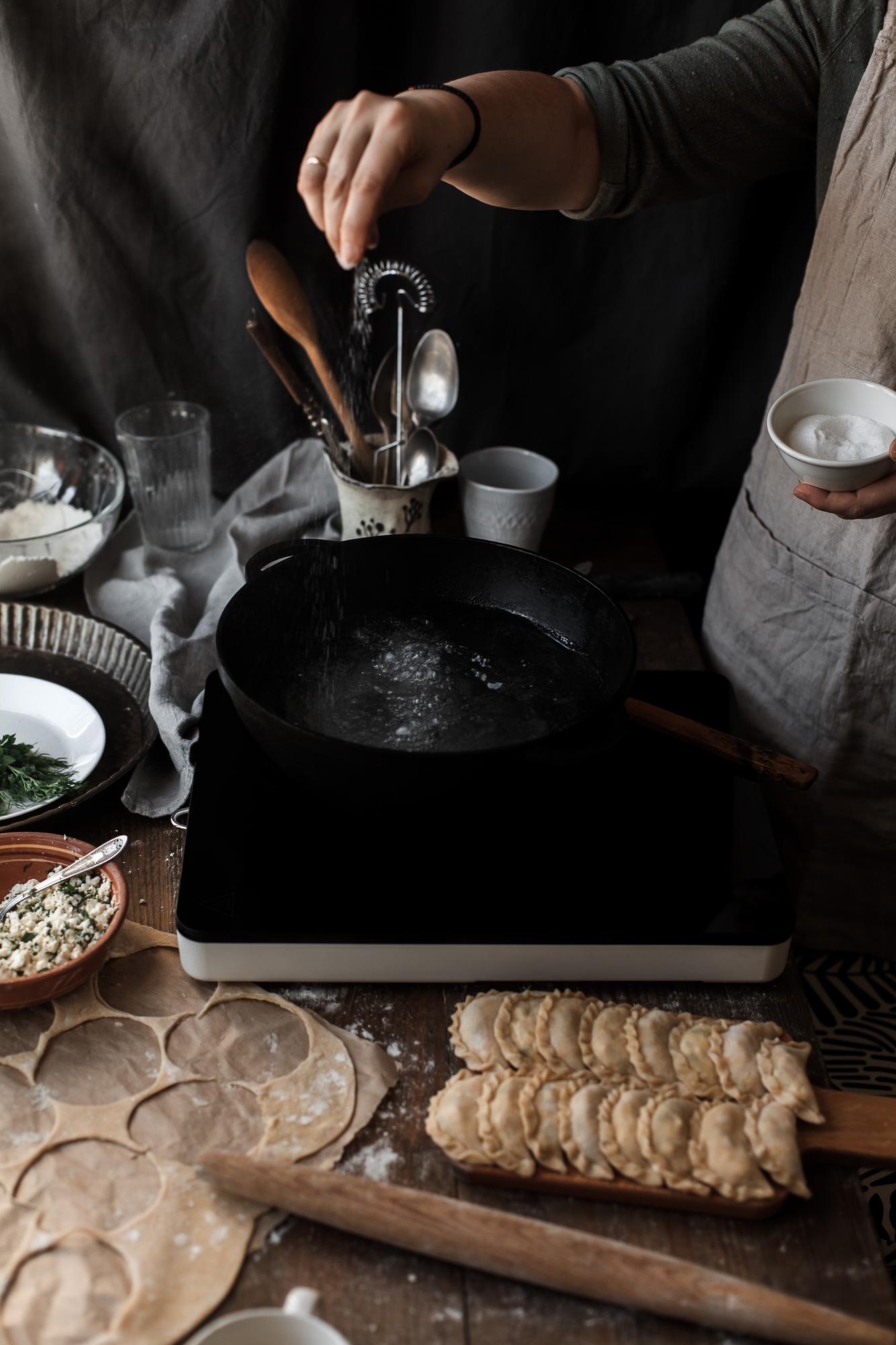 Artisan kitchen with copper pans and marble surface